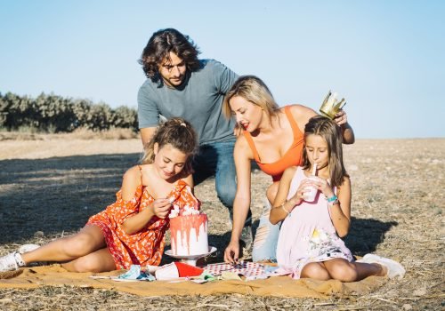 family-celebrating-birthday-picnic